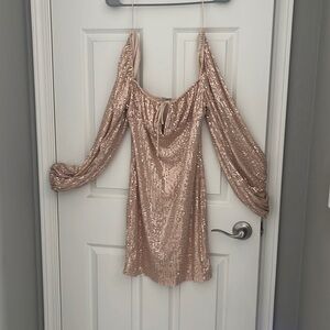 Gold long-sleeve mini dress.